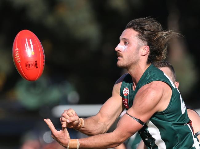 EDFL footy: Airport West v Westmeadows23 Lachlan Di Sebastiano  for  Airport West  handballs.Picture: Stuart Milligan