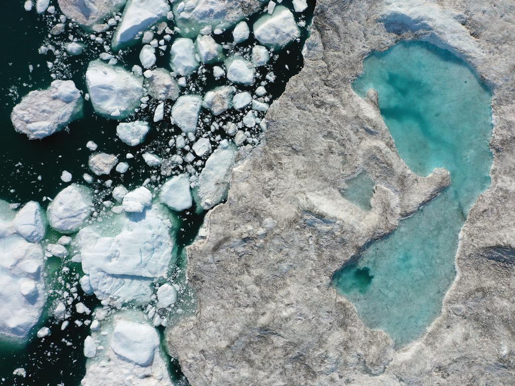 An aerial view of melting ice forming a lake on free-floating ice in Greenland. Picture: Sean Gallup/Getty Images