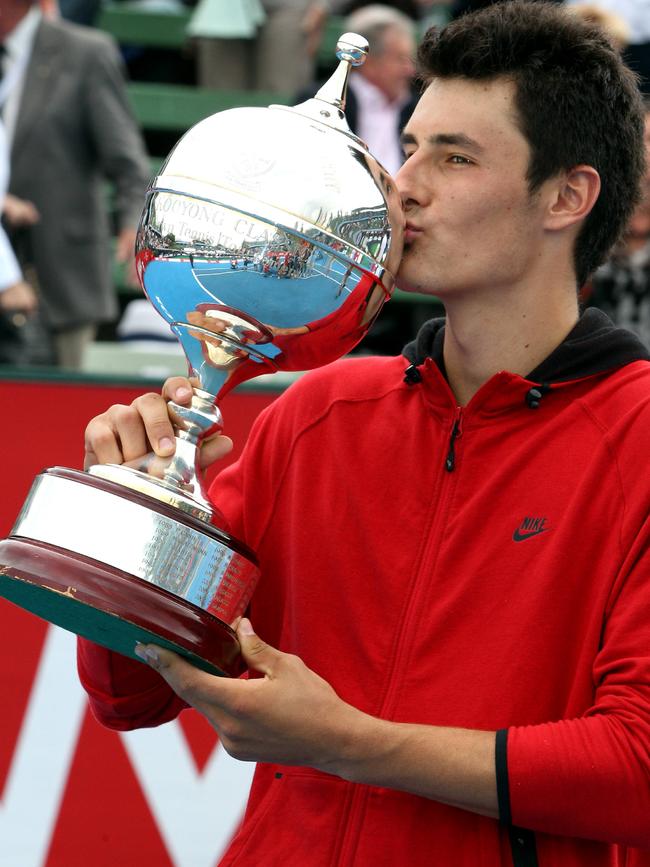 Bernard Tomic with the Kooyong Classic trophy in 2012.