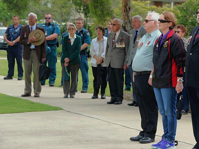 LEST WE FORGET: Commemorators gathered in the rain for Gatton's Remembrance Day services on November 11 2017. Gatton RSL sub-branch treasurer Ken Slater, Kristy Dobson and Steve Hartigan pay their respects.