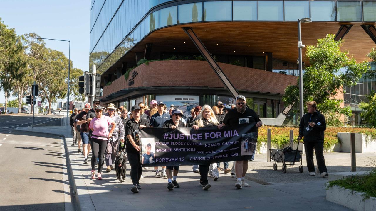 Mia’s March participants pass Geelong council headquarters on Mercer St, led by Mia Rossiter’s parents Paul and Dani Rossiter. Picture: Brad Fleet