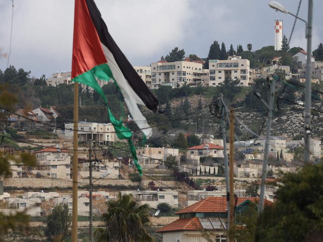 The village of Turmus Ayya near Ramallah city shows the nearby Israeli Shilo settlement in the background, in the occupied West Bank. Picture: AFP