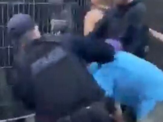 Footage shared on social media appears to show a police officer hitting a protester at Kangaroo Point from behind. Police say they are reviewing the footage.