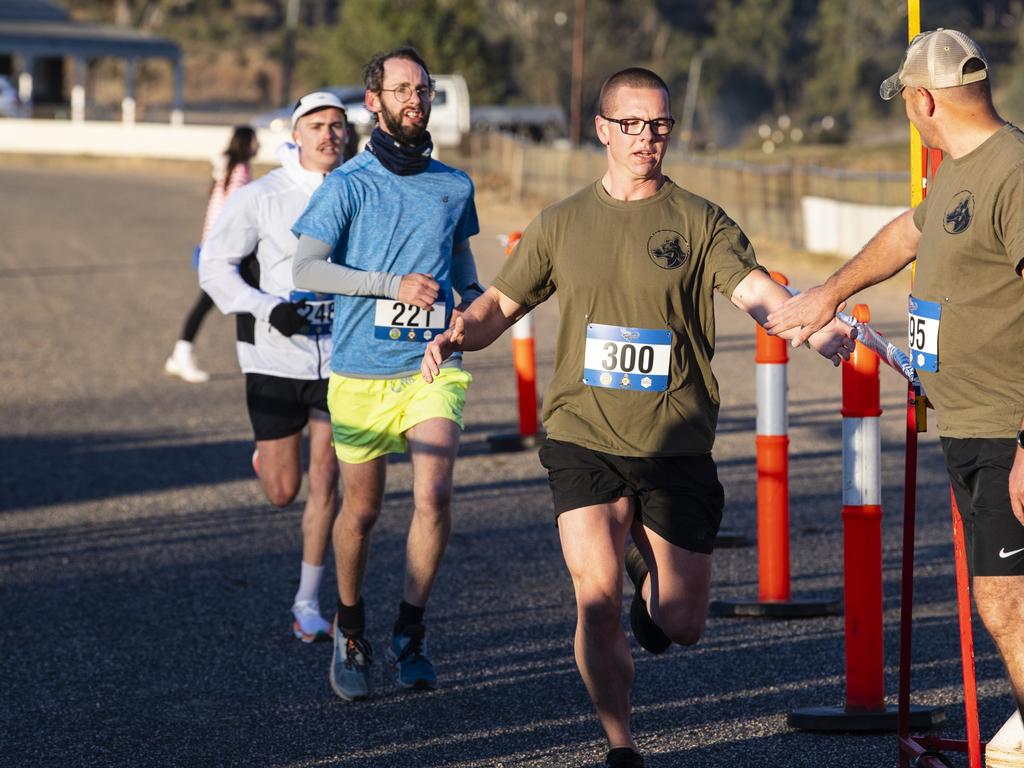 Jared Barton finishes a lap for team Defence Force School of Signals - Electronic Warfare Wing during 40 for Fortey relay at Toowoomba Showgrounds, Sunday, May 28, 2023. Picture: Kevin Farmer