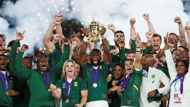 South Africa's Siya Kolisi (C) lifts the Webb Ellis Cup after winning the 2019 Rugby Union World Cup. Picture: AFP