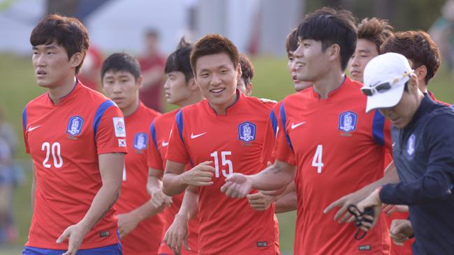 South Korea's football team held an open training session at Macquarie University Sports Grounds in preparation for the Asian Cup. Pictured are players training and Korean fans celebrating.