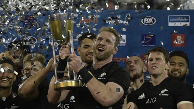 All Blacks captain Kieran Read holds the Rugby Championship trophy.