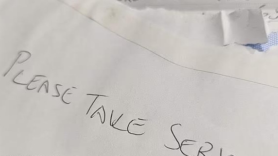 The neighbour's letter came in an envelope that pleaded with the woman to please take it seriously.