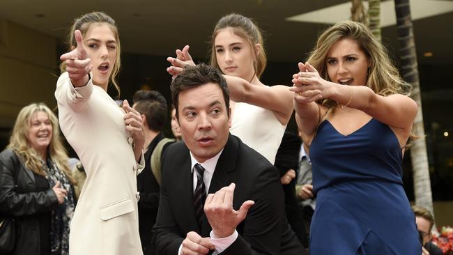 Jimmy Fallon, host of the 74th Annual Golden Globe Awards, poses with Miss Golden Globes 2017, from left, sisters Sistine, Scarlet and Sophia Stallone after rolling out the red carpet during Golden Globe Awards Preview Day. Picture: Chris Pizzello/Invision/AP