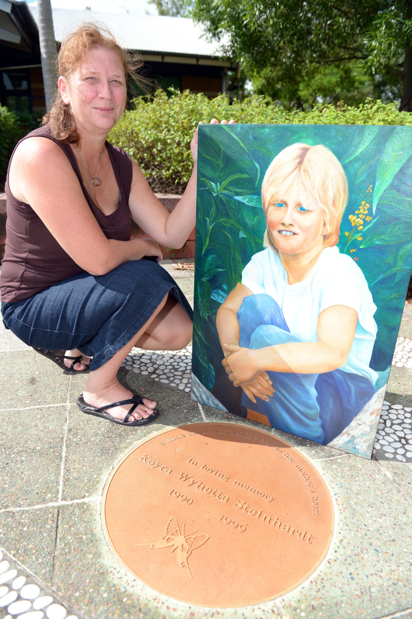 Treasa Steinhardt at the Keyra Stenhardt memorial at the North Rockhampton police station, as the 15th anniversary of Keyra's murder nears. Photo Sharyn O'Neill / The Morning Bulletin