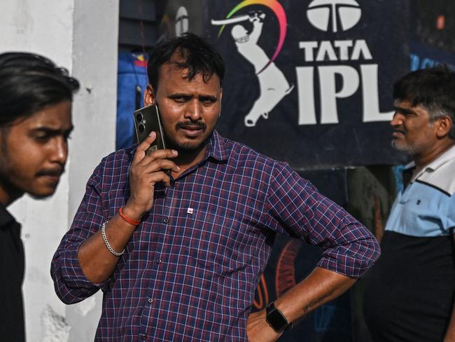 Cricket fans stand outside the Ekana Cricket Stadium in Lucknow after the IPL tournament was suspended. Picture: Arun Sankar/AFP