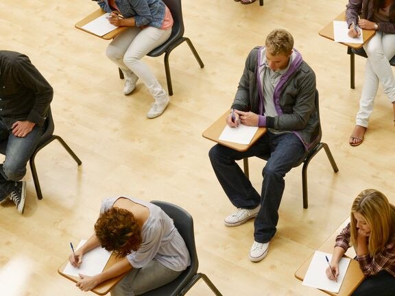 Students sit for a proctored standardized test before the Covid-19 pandemic. Chris Ryan via Getty Images