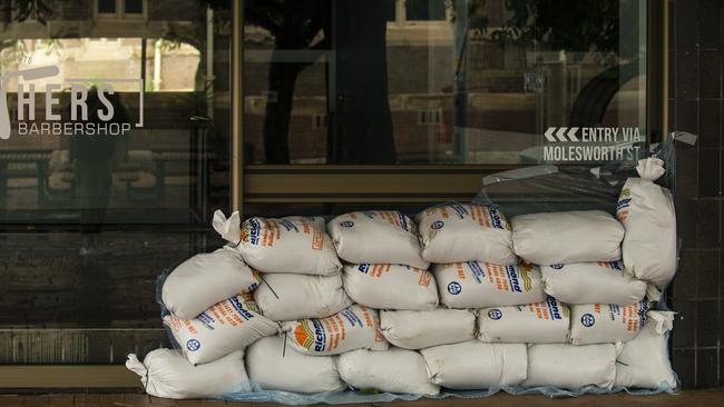 Sandbags were placed in doorways at businesses in Lismore on Thursday. Picture: NewsWire / Glenn Campbell