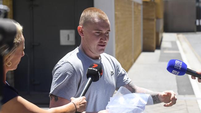 Alleged neo Nazi Mason Robbins leaves Adelaide Magistrates court on Tuesday.