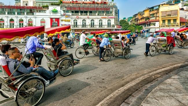 I pull up a wooden stool at Cafe Giang, hidden in the maze of 36 streets said to make up Hanoi’s Old Quarter.