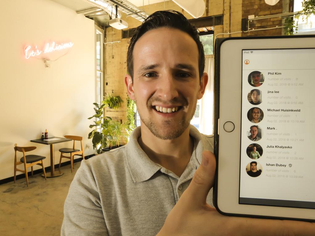 Michael Huisinkveld shows the customer profiles accessible via Birdee’s facial recognition. Picture: Mark Cranitch