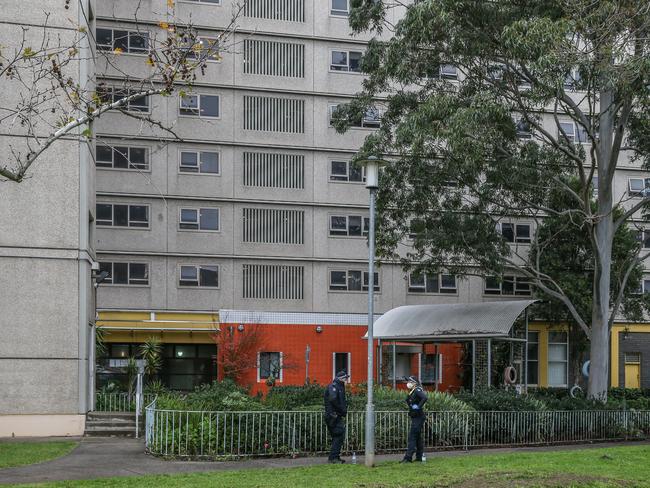 MELBOURNE, AUSTRALIA - JULY 05: Police are seen on patrol outside the North Melbourne Public housing flats on July 05, 2020 in Melbourne, Australia. Nine public housing estates have been placed into mandatory lockdown and two additional suburbs are under stay-at-home orders as authorities work to stop further COVID-19 outbreaks in Melbourne. The public housing towers will be in total lockdown for at least five days following a high number of positive coronavirus cases recorded in residents on those estates. The towers will be closed and contained, and the only people allowed in and out will be those providing essential services. Police will be placed on each floor of the towers and other police will control access points to the estates. Residents of 12 Melbourne hotspot postcodes are also on stay-at-home orders and are only able to leave home for exercise or work, to buy essential items including food or to access childcare and healthcare. Businesses and facilities in these lockdown areas are also restricted and cafes and restaurants can only open for takeaway and delivery.  (Photo by Asanka Ratnayake/Getty Images)