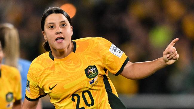 FILES-- This file photo taken on August 16, 2023 shows Australia's forward Sam Kerr celebrating scoring her team's first goal during the Australia and New Zealand 2023 Women's World Cup semi-final football match between Australia and England at Stadium Australia in Sydney. Chelsea and Australian women's football star Sam Kerr has been charged with a "racially aggravated offence" in Britain following a dispute involving a police officer, London's Metropolitan Police said March 4.  The 30-year-old striker, one of the highest profile and best-paid players in the women's game, was charged following an incident in London in January 2023, a police statement read. (Photo by IZHAR KHAN / AFP)