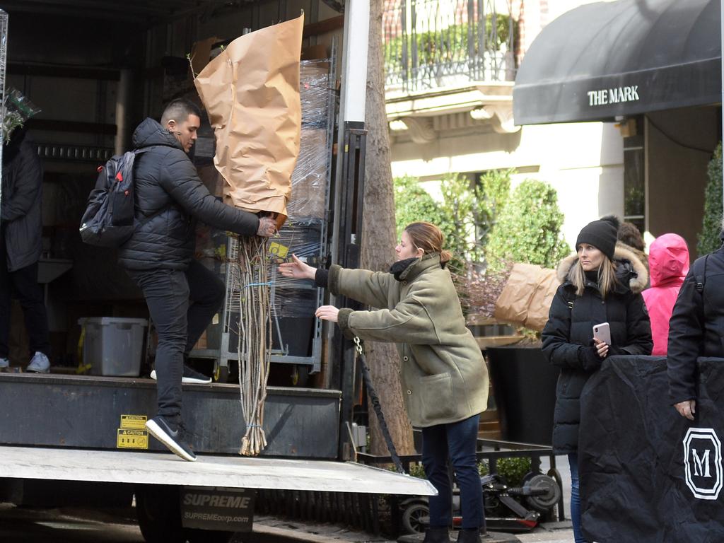 Floral arrangements are delivered to staff at the hotel. Picture: BackGrid 