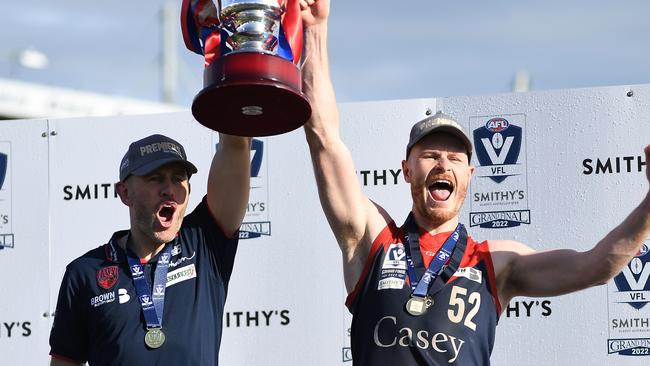 MELBOURNE, AUSTRALIA - SEPTEMBER 18: Mark Corrigan, coach of the Casey Demons and Mitch White of the Casey Demons celebrate after the 2022 VFL Grand Final match between the Casey Demons and the Southport Sharks at Ikon Park on September 18, 2022 in Melbourne, Australia. (Photo by Felicity Elliott/AFL Photos via Getty Images)