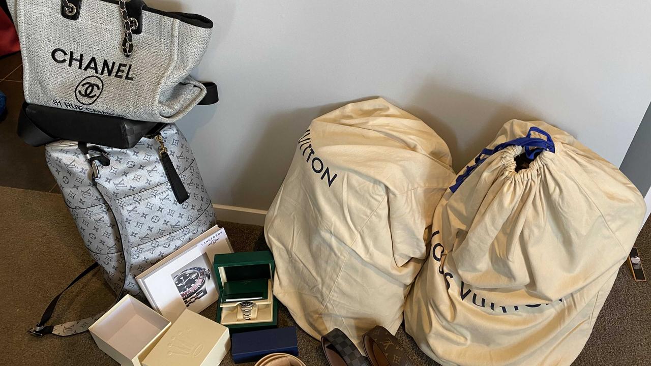 Criminal syndicates were targeted under AFP-led Operation Ironside in Mermaid Waters, Gold Coast. Pictured is designer brand Chanel and Louis Vuitton bags and belts. Picture: AFP