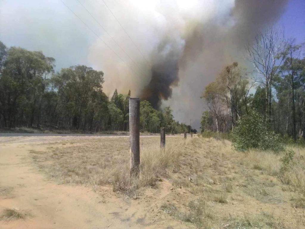 A plume of smoke from a large bushfire burning near Ayers Rock Rd, Cypress Gardens.