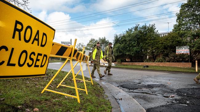 Australian Defence Force personnel helping flood-affected residents at Windsor in NSW. Picture: Flavio Brancaleone