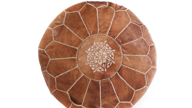 Tan Moroccan pouf, $179, from Cush &amp; Co