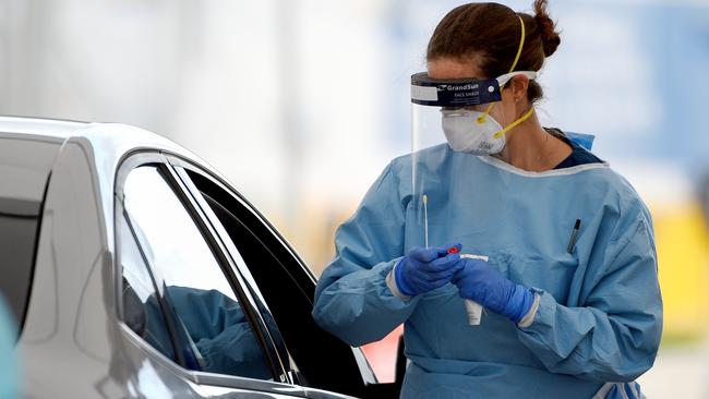 Medical professionals perform COVID-19 tests on members of the public at the Bondi Beach drive-through COVID-19 testing centre. Picture: AAP