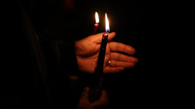 Members of the public light candles in memory of MP Sir David Amess at Belfairs Sports Ground in Leigh-on-Sea, Britain. Picture: Getty Images