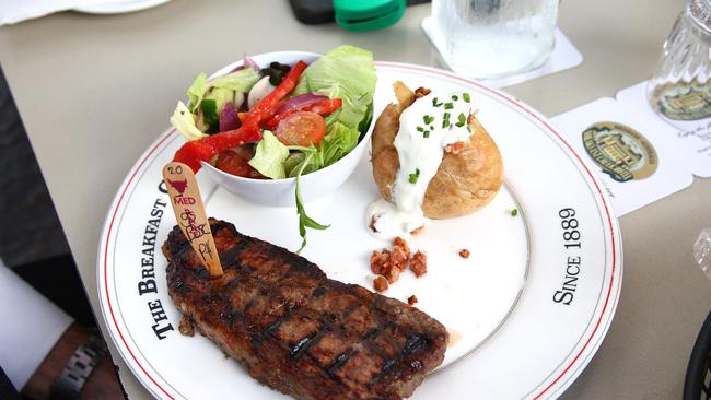 Porterhouse steak medium rare, Idaho potato with sour cream and bacon, garden salad. Breakfast Creek Hotel. Picture David Clark