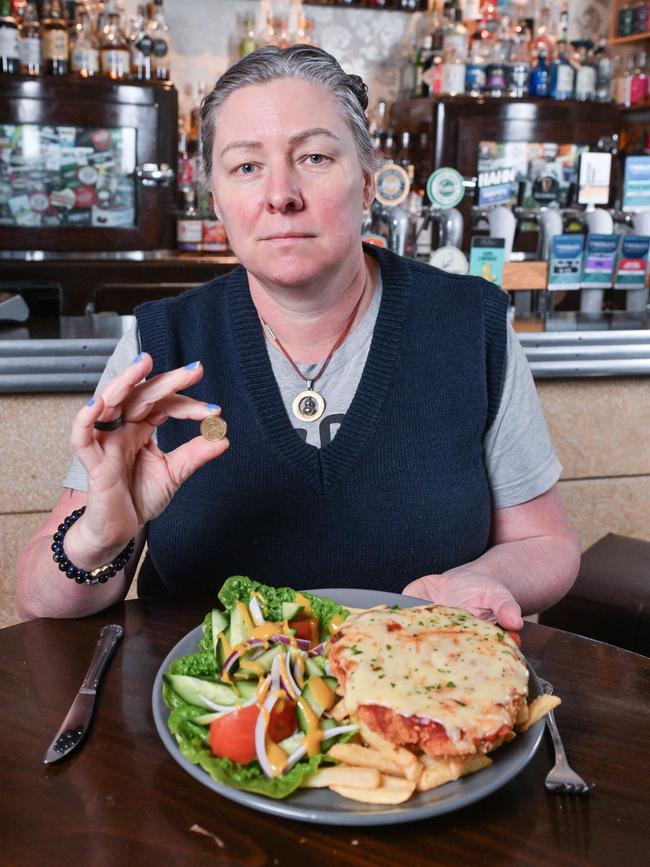 Duke of Brunswick owner Simone Douglas with a $33.50 chicken schnitzel with salad. Picture: Brenton Edwards