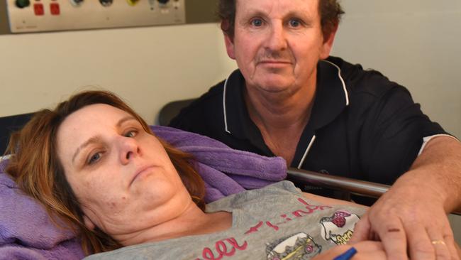 Jodie Burns is comforted at the Royal Melbourne Hospital by her husband, Colin Boyd. Picture: Tony Gough