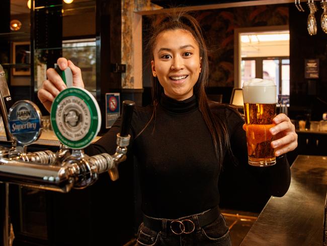 Julienne Vargas gets ready to pour beers at the Sussex Hotel, Walkerville. Picture: Matt Turner