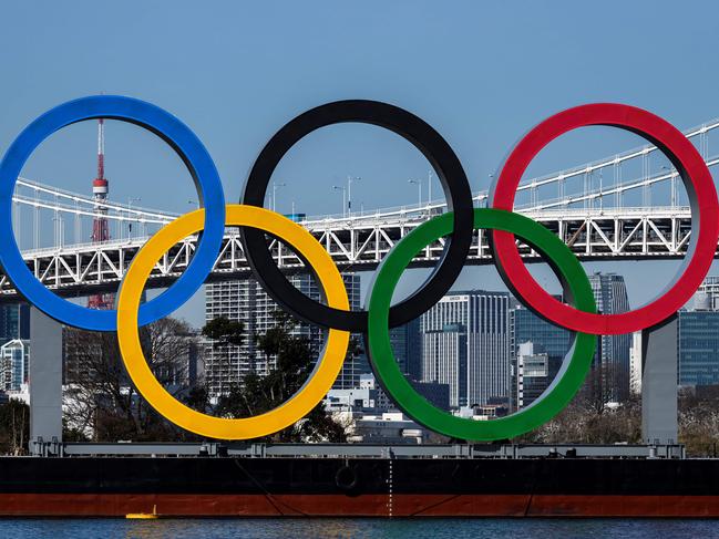 (FILES) This file photo taken on February 10, 2021 shows the Olympic Rings at the Odaiba waterfront in Tokyo. - Japan announced a new virus state of emergency in Tokyo and three other regions on April 23, 2021, as the country battles surging infections just three months before the Olympic opening ceremony. (Photo by Charly TRIBALLEAU / AFP)