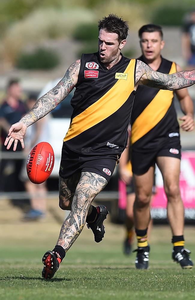 Dane Swan gets a kick away during his return appearance for Westmeadows. Picture: Lawrence Pinder.