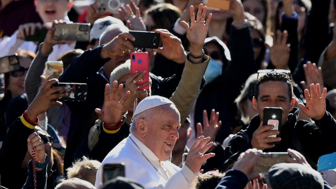 Pope Francis waves as he arrives at St Peters’ square in the Vatican, on April 26, 2023.