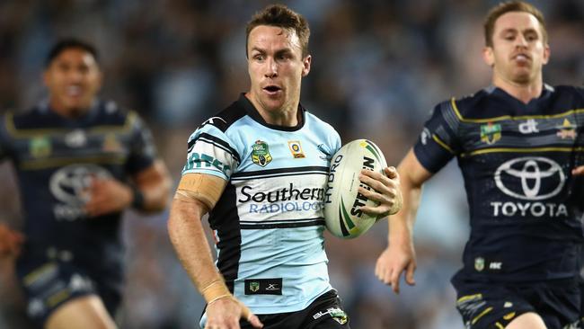 James Maloney makes a break for the Sharks against the Cowboys.