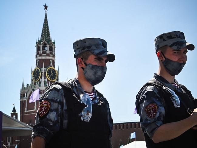 Russian servicemen wearing face masks walk along Red Square in central Moscow amid the crisis linked with the Covid-19 pandemic. Picture: AFP