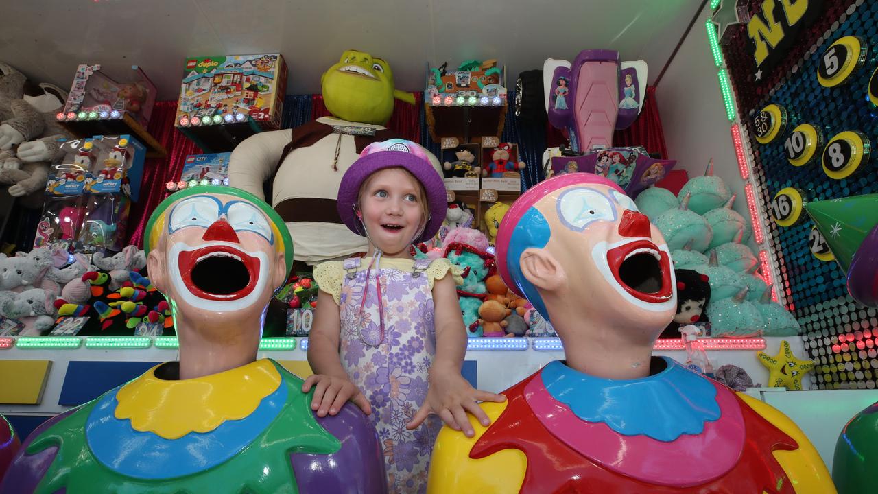 Huge crowds for the first day of the Gold Coast Show. Laughing with the clowns is Lennox Bridge, 4. Picture: Glenn Hampson