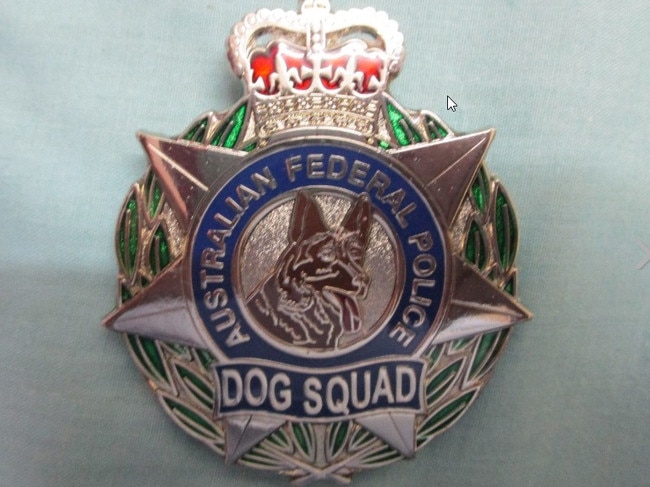 An AFP Dog Squad badge for sale on eBay.