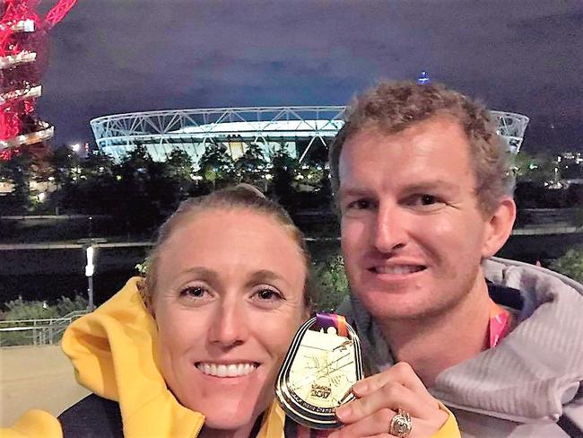 Pearson savours her shock gold medal moment with husband Kieran.