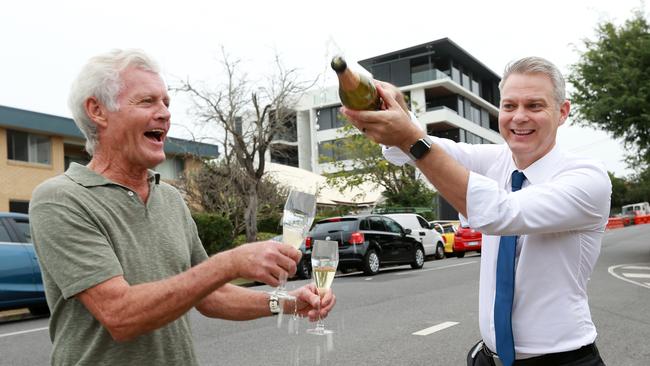 Resident Gervase Griffith and Cr James Mackay celebrate the drop in the speed limit on Swann Rd.