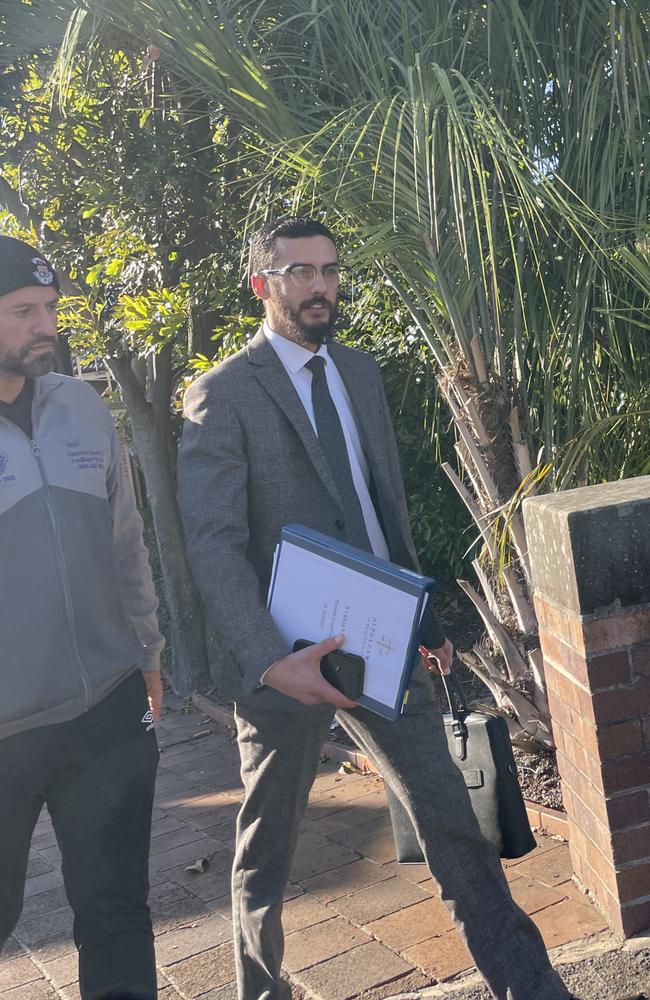 Football referee Khodr Ahmad Yaghi (L) leaving Hornsby Local Court with his lawyer Mohammed Zreika.