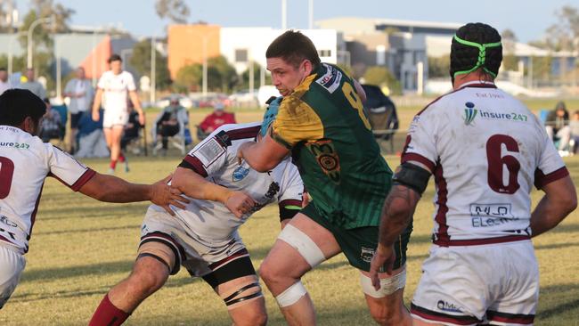 Round 16 Gold Coast District Rugby Union first grade game between Surfers Dolphins and Nerang Bulls. Nerang Player No 20 Mat Monahan Surfers Player No 8 James Brown Pic Mike Batterham