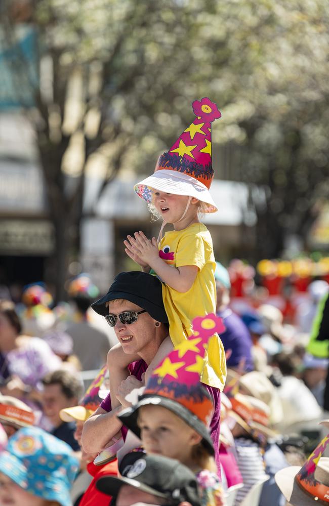 Felicity Ingall gets a good view from the shoulders of Jane Ingall at the Grand Central Floral Parade of the Carnival of Flowers, Saturday, September 21, 2024. Picture: Kevin Farmer