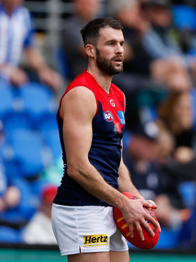 Joel Smith in action for the Demons. Photo by Dylan Burns/AFL Photos