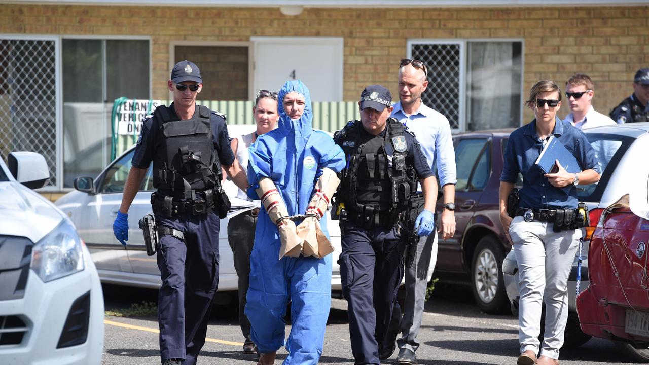 Police take a man into custody following an alleged murder at a unit at 146 Cambridge St, Granville.