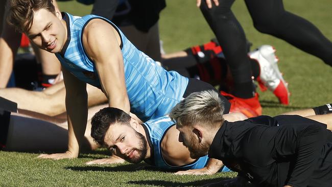 Conor McKenna, middle, training with teammates on July 01 at Essendon HQ. Picture: Getty