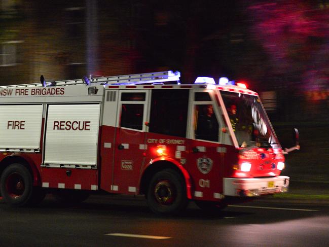 Fire Brigade on a false alarm. Up to 6 units called to housing commission on Moorehead st Redfern. Fire truck, fire engine, fire department. Generic. Photographed with: Nikon D4